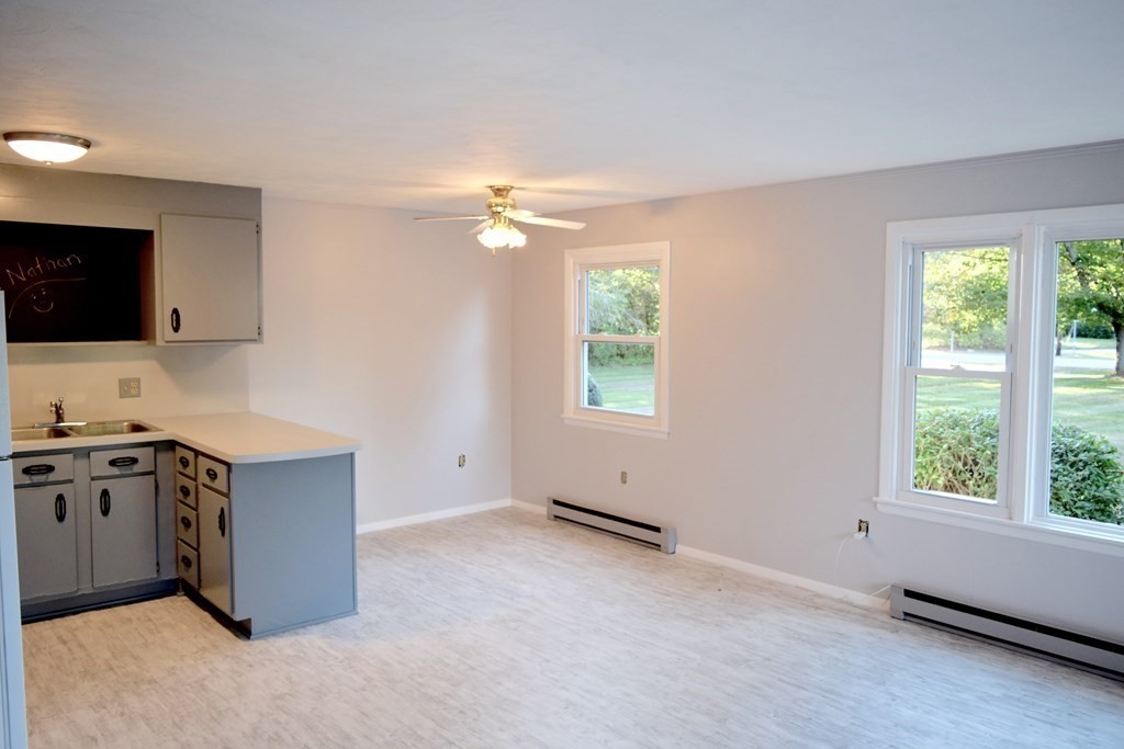 2240-2242 Barre Road Hardwick, MA 01031 - Photo 27 of 31 a kitchen with stainless steel appliances granite countertop a stove a sink and a microwave