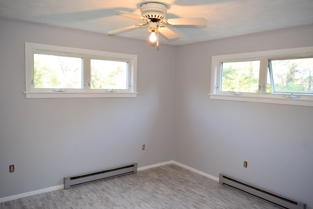 2240-2242 Barre Road Hardwick, MA 01031 - Photo 28 of 31 an empty room with a window and a fan