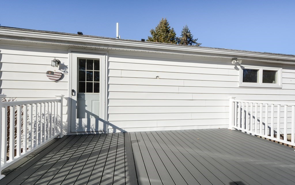 2240-2242 Barre Road Hardwick, MA 01031 - Photo 8 of 31 a view of a balcony with wooden floor and fence