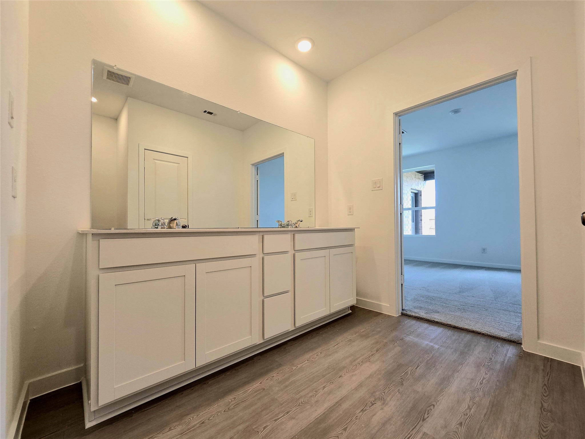 3112 Ruby Ridge Drive Katy, TX 77493 - Photo 15 of 24 a bathroom with a double vanity sink and mirror