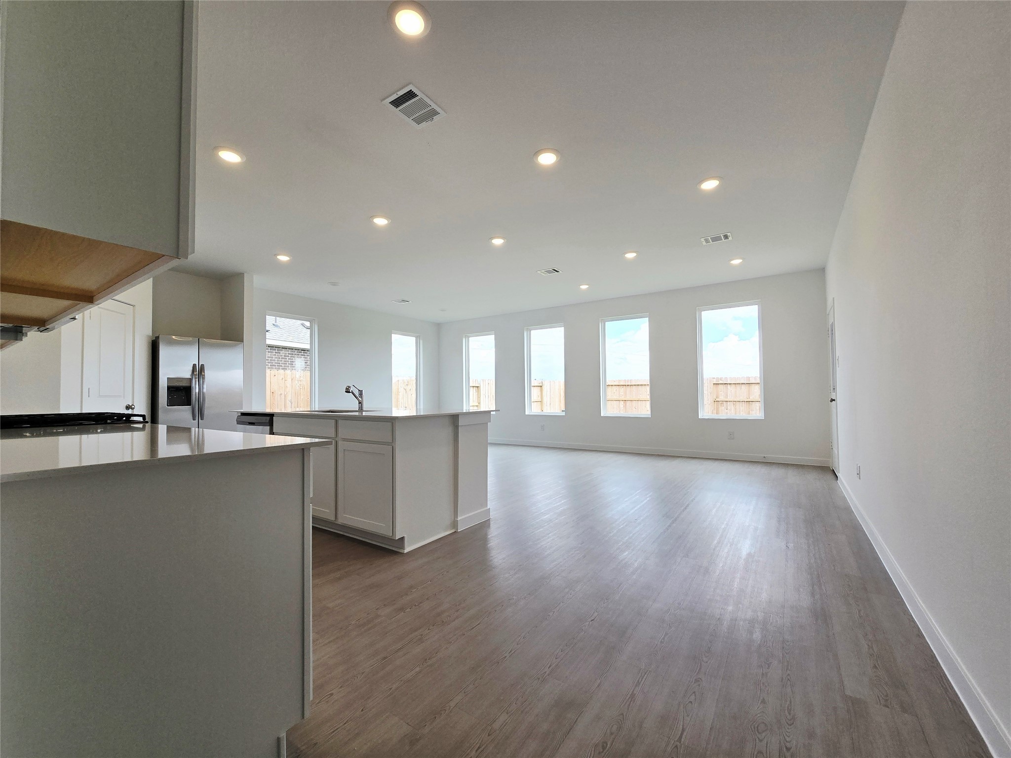 3112 Ruby Ridge Drive Katy, TX 77493 - Photo 19 of 24 a view of kitchen and kitchen with stainless steel appliances wooden floor