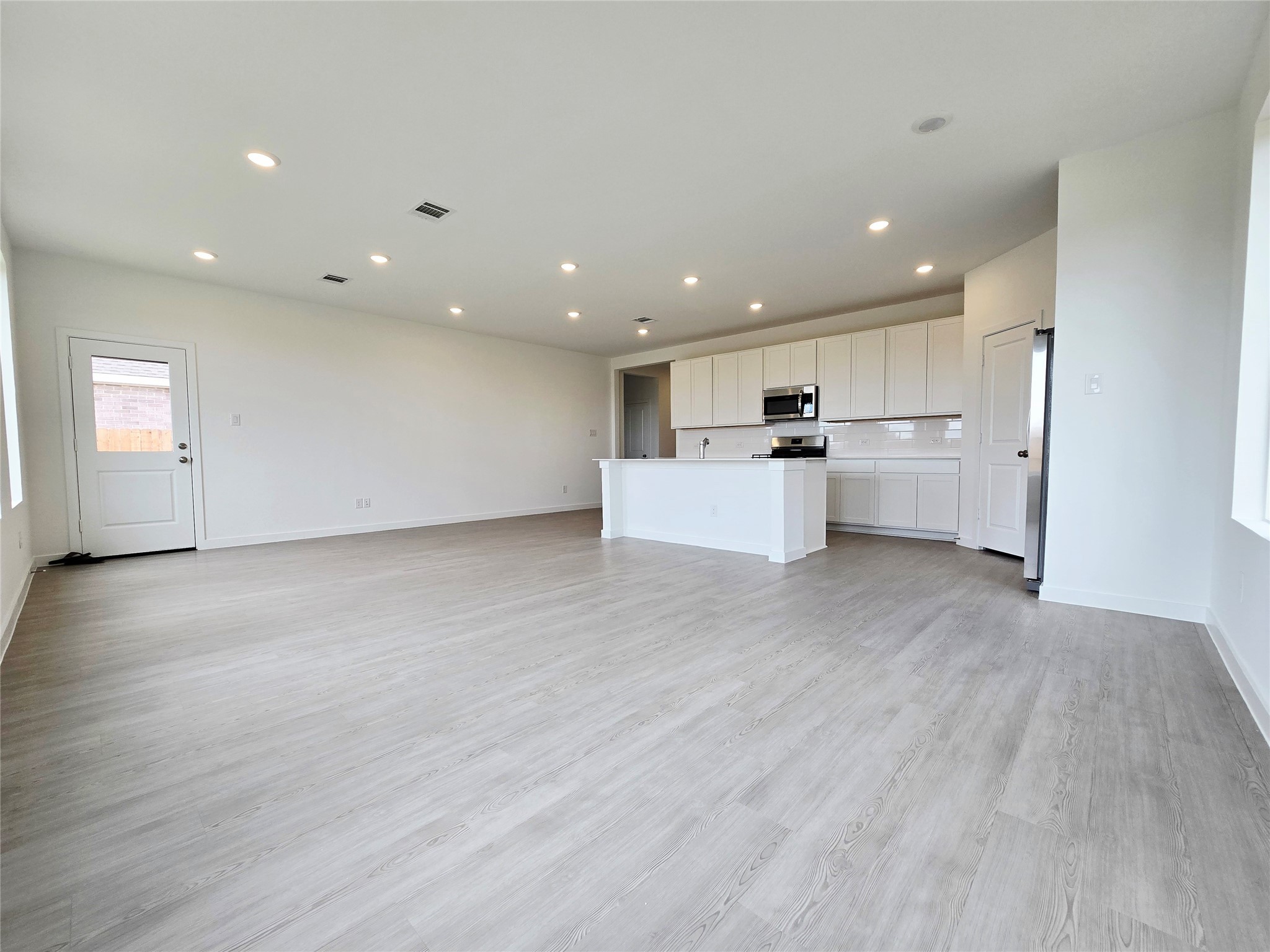 3112 Ruby Ridge Drive Katy, TX 77493 - Photo 21 of 24 a view of kitchen with wooden floor and electronic appliances