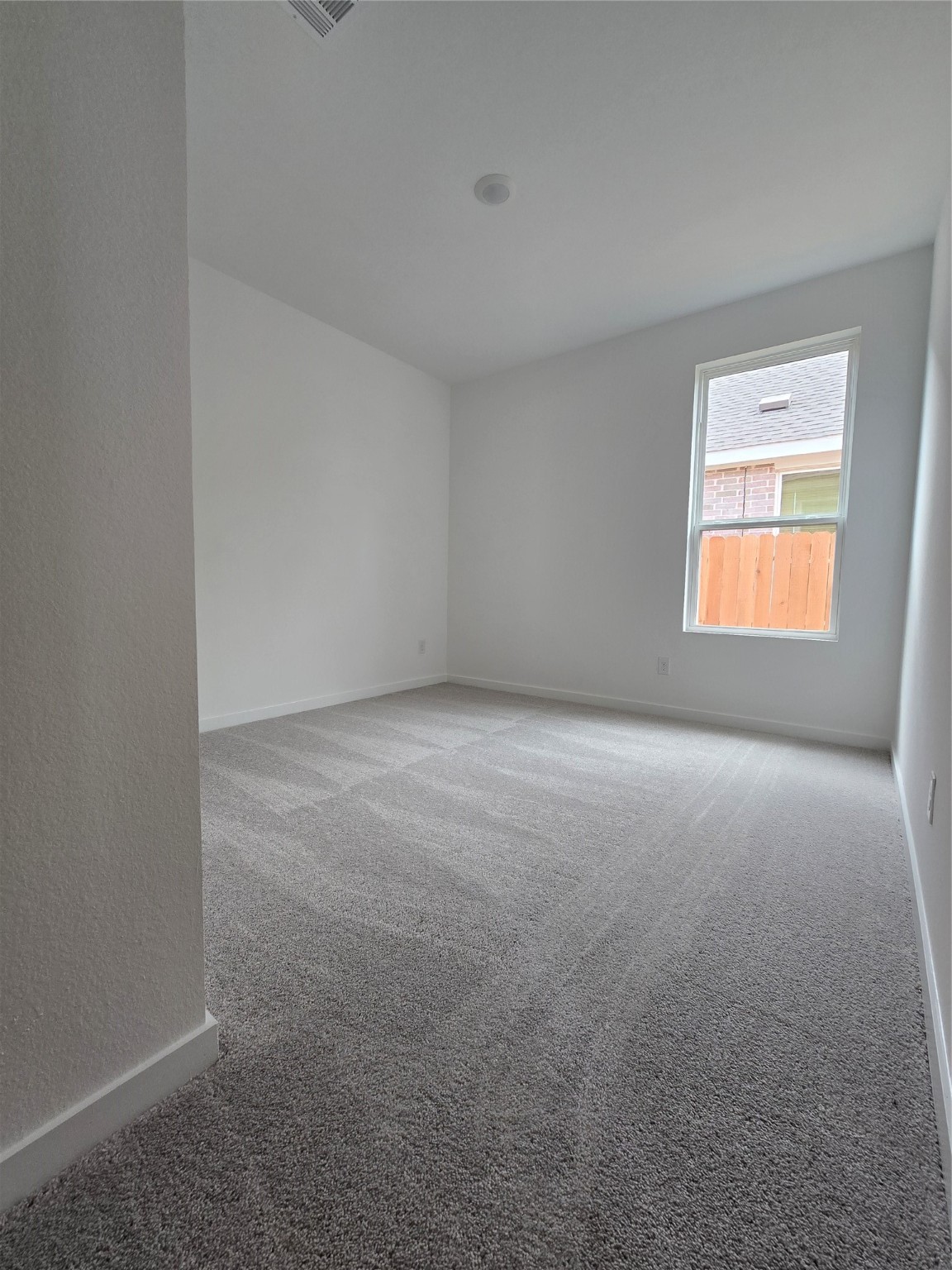 3112 Ruby Ridge Drive Katy, TX 77493 - Photo 8 of 24 a view of an empty room with a window