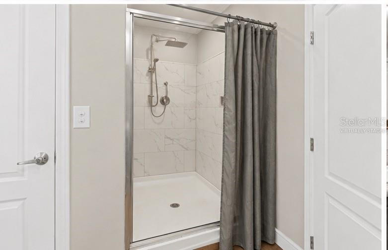 8010 Palmer Road Bartow, FL 33830 - Photo 13 of 22 a bathroom with a glass shower door