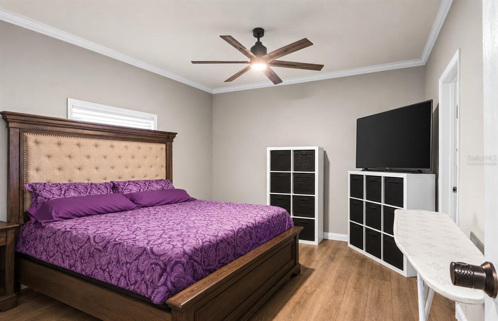 8010 Palmer Road Bartow, FL 33830 - Photo 14 of 22 a bedroom with a bed and a flat screen tv