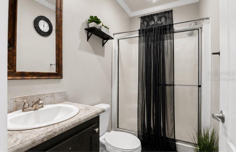 8010 Palmer Road Bartow, FL 33830 - Photo 17 of 22 a bathroom with a granite countertop sink toilet and shower