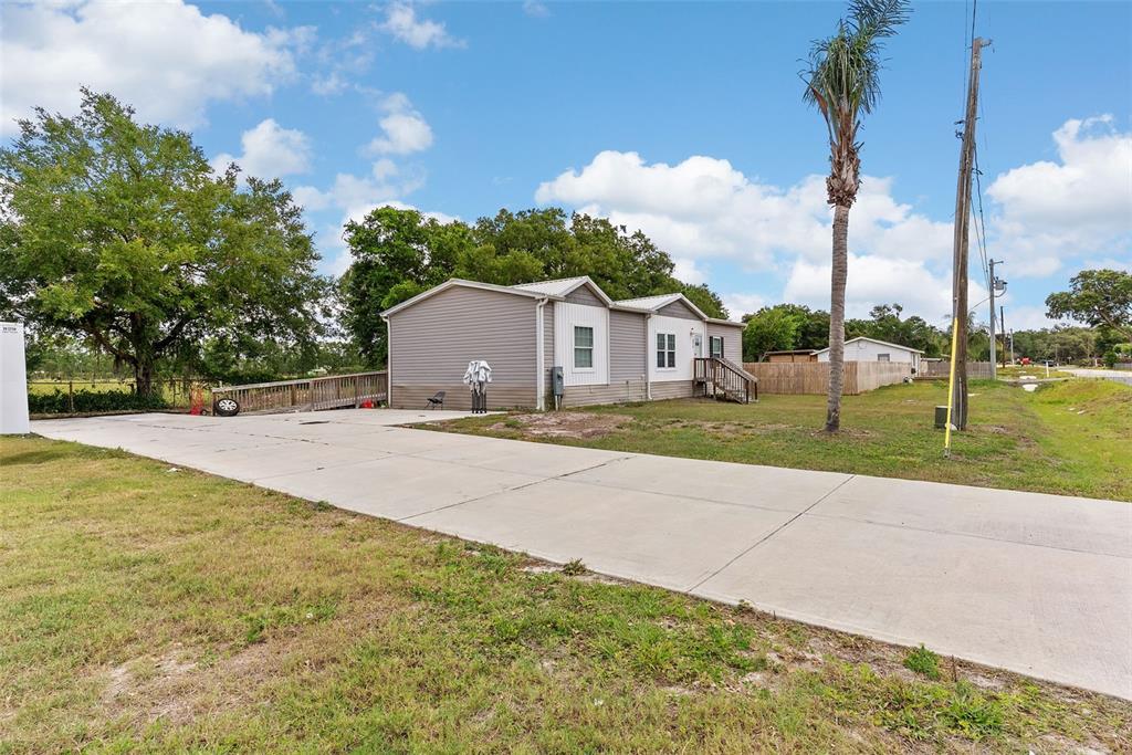 8010 Palmer Road Bartow, FL 33830 - Photo 4 of 22 a house with yard and view of street