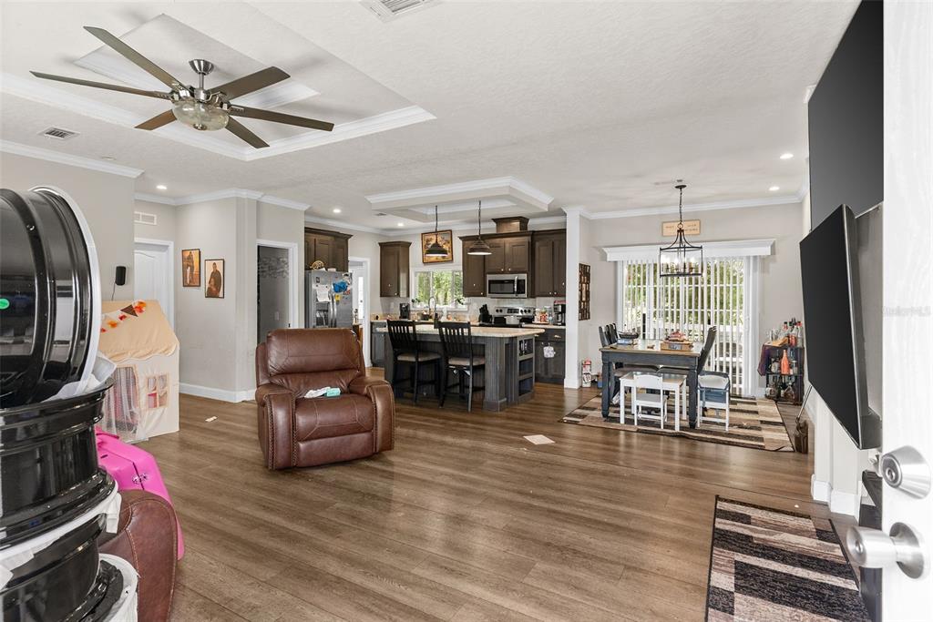 8010 Palmer Road Bartow, FL 33830 - Photo 5 of 22 a living room with furniture kitchen view and a flat screen tv