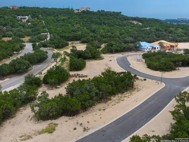 an aerial view of a house with mountain view