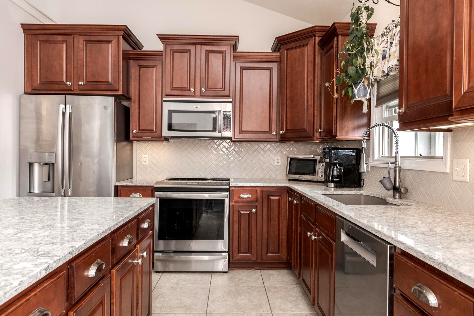 36 Lone Oak Court Bloomington, IL 61705 - Photo 12 of 63 a kitchen with stainless steel appliances granite countertop a sink stove and refrigerator