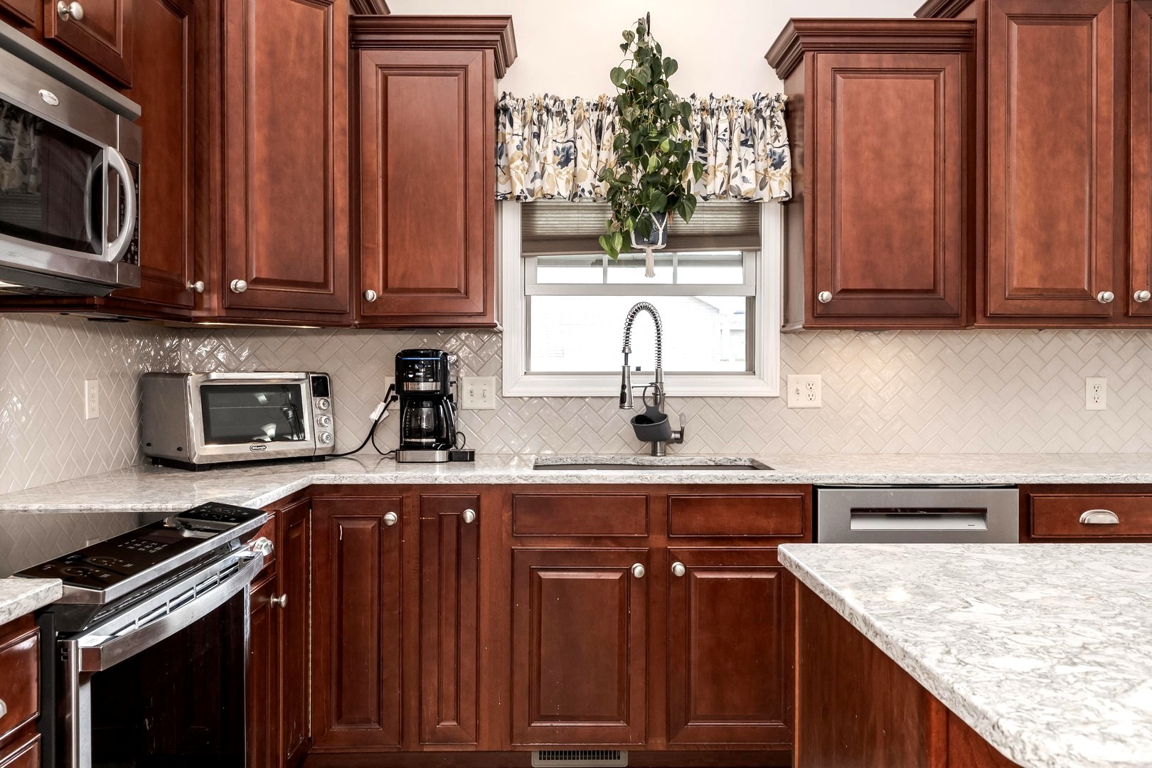 36 Lone Oak Court Bloomington, IL 61705 - Photo 13 of 63 a kitchen with stainless steel appliances granite countertop a sink stove and microwave