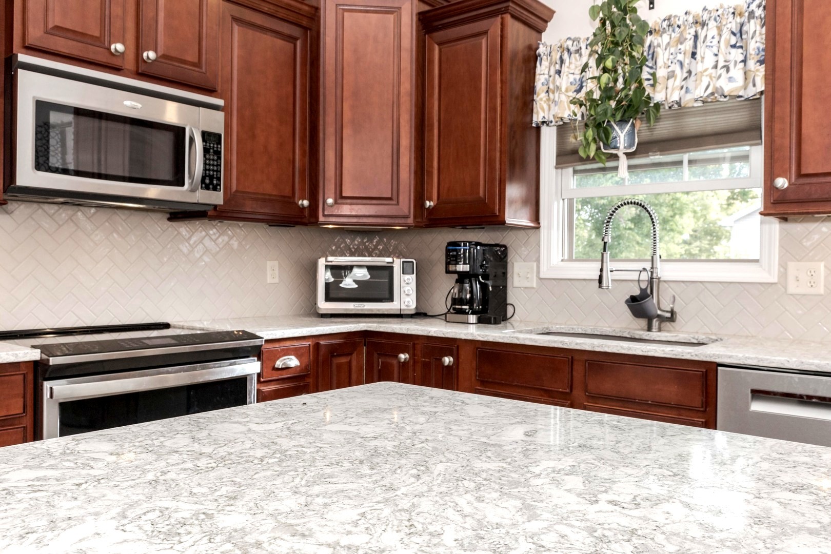 36 Lone Oak Court Bloomington, IL 61705 - Photo 14 of 63 a kitchen with stainless steel appliances granite countertop a stove microwave and sink