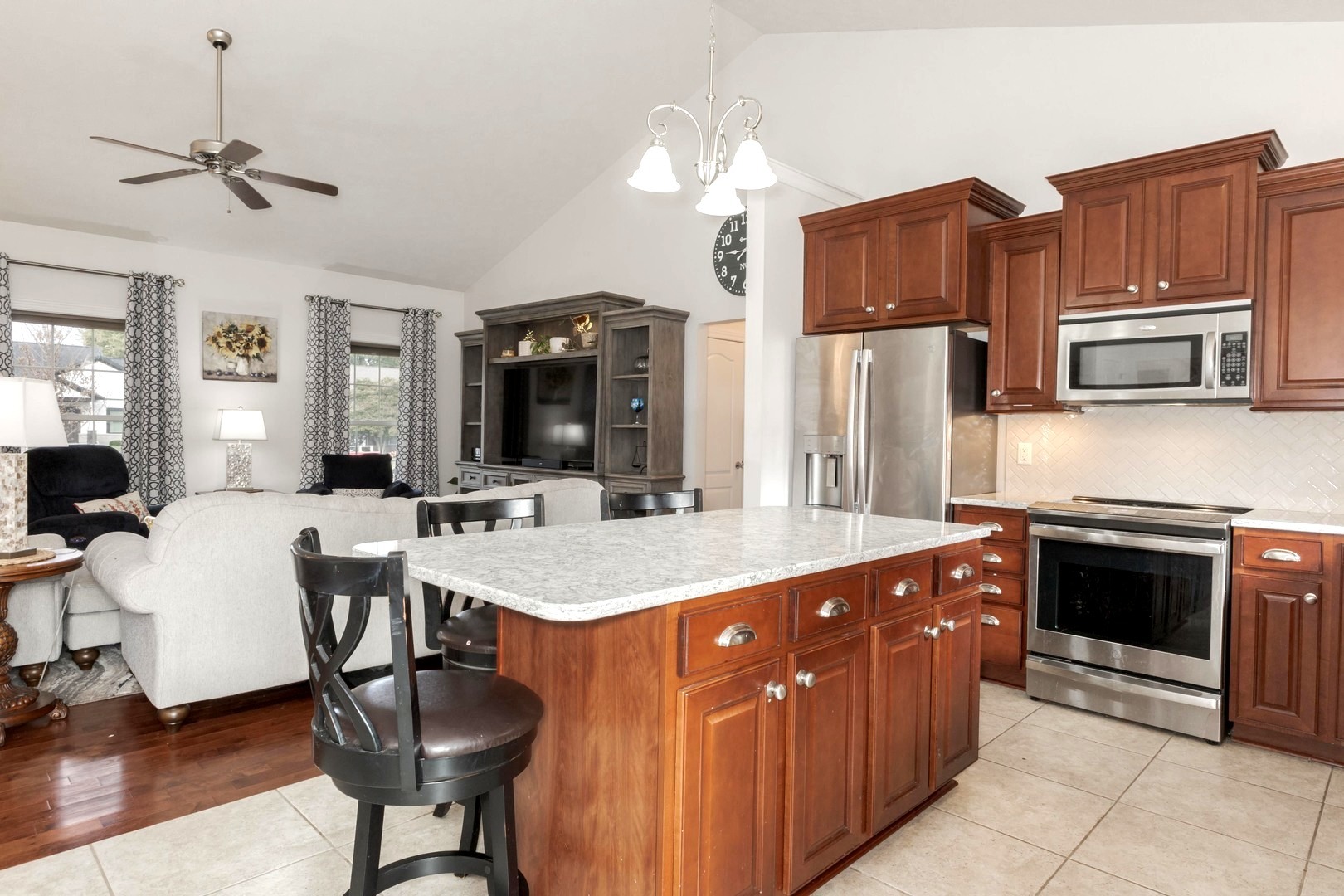 36 Lone Oak Court Bloomington, IL 61705 - Photo 15 of 63 a kitchen with stainless steel appliances a stove refrigerator dining table and chairs
