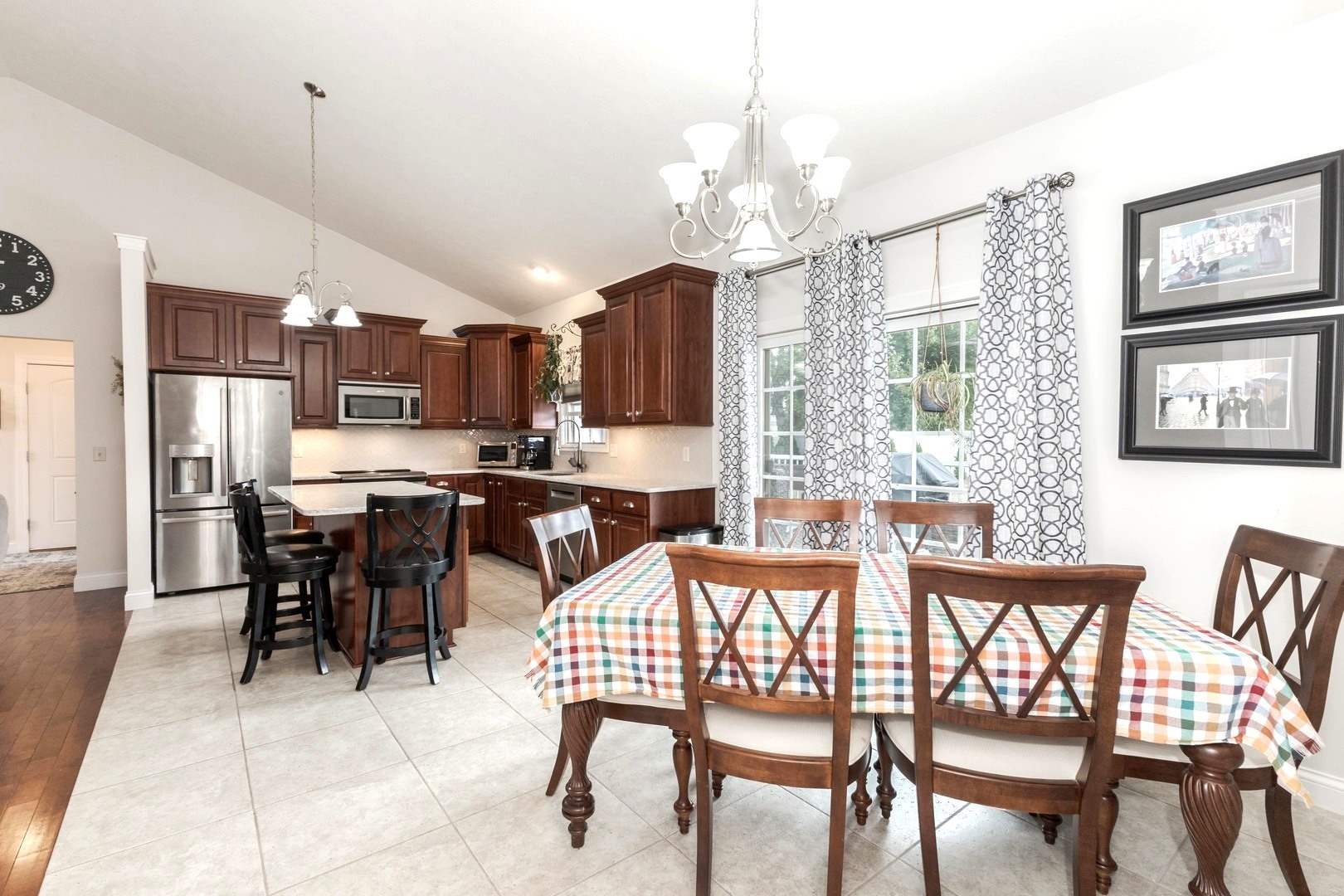 36 Lone Oak Court Bloomington, IL 61705 - Photo 19 of 63 a view of a dining room with furniture a chandelier and kitchen view