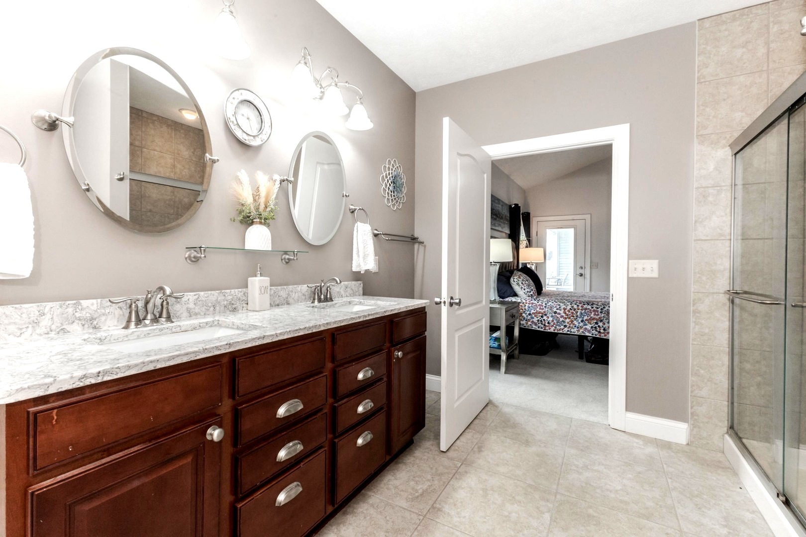 36 Lone Oak Court Bloomington, IL 61705 - Photo 25 of 63 a en suite bathroom with a double vanity sink and a mirror