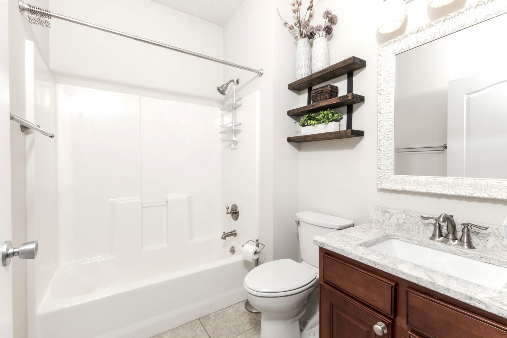 36 Lone Oak Court Bloomington, IL 61705 - Photo 33 of 63 a bathroom with a granite countertop sink a toilet and shower