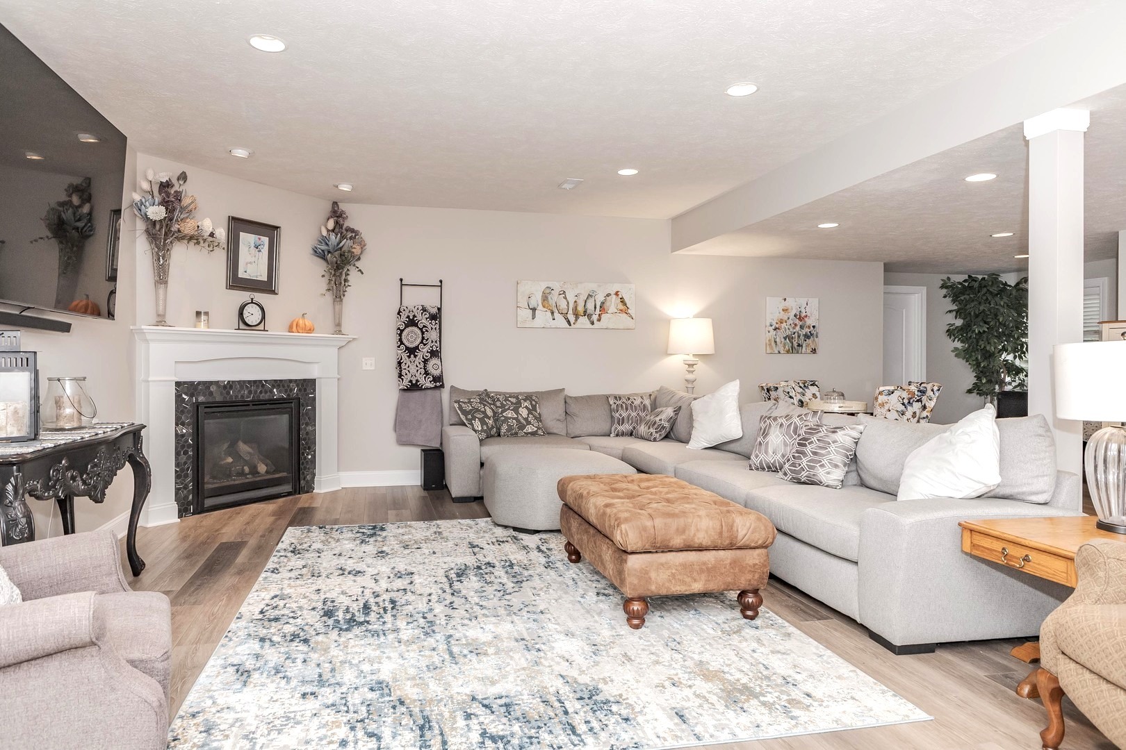 36 Lone Oak Court Bloomington, IL 61705 - Photo 36 of 63 a living room with furniture and a fireplace