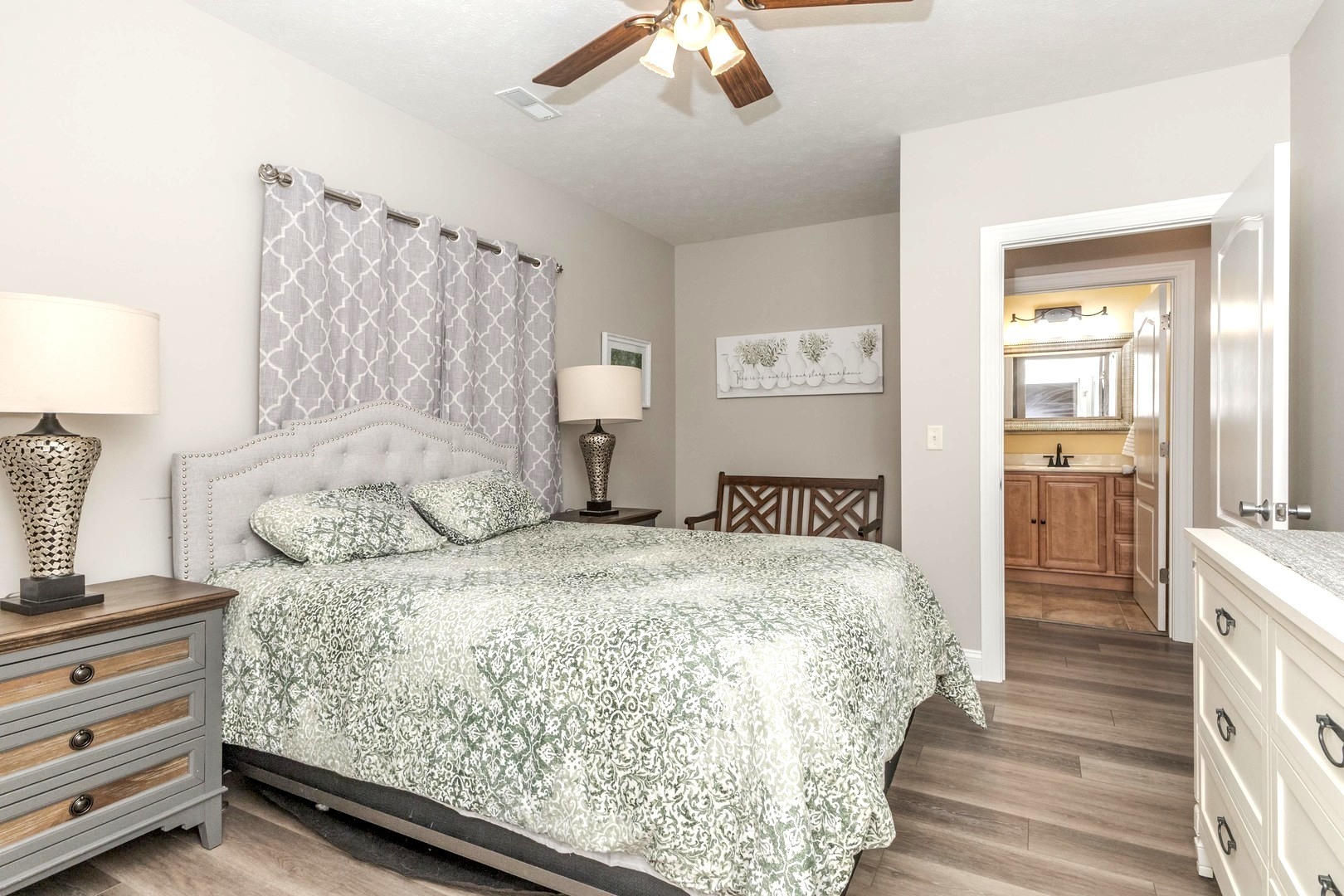 36 Lone Oak Court Bloomington, IL 61705 - Photo 42 of 63 a bedroom with a bed and a chandelier