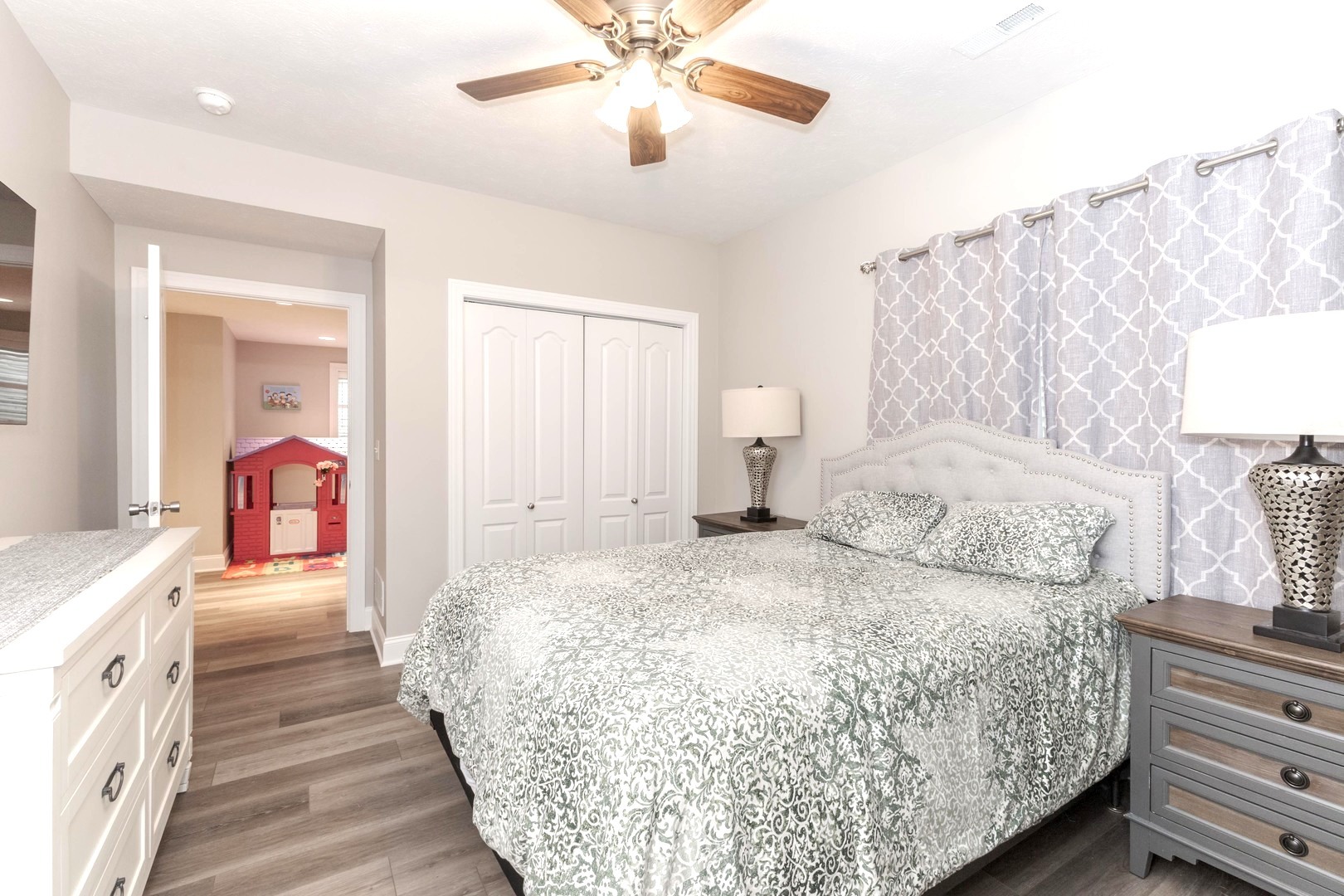 36 Lone Oak Court Bloomington, IL 61705 - Photo 43 of 63 a bedroom with a bed and a chandelier