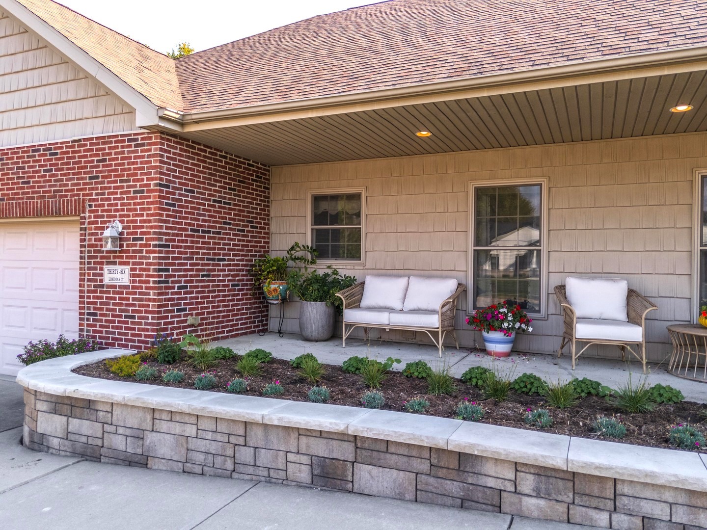 36 Lone Oak Court Bloomington, IL 61705 - Photo 59 of 63 a front view of a house with potted plants