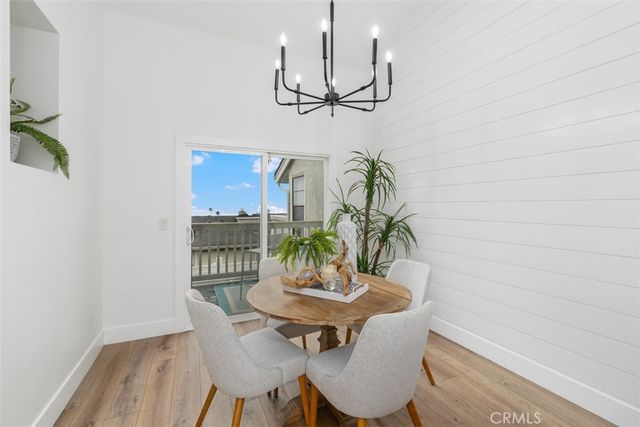 a view of a dining room with furniture and window