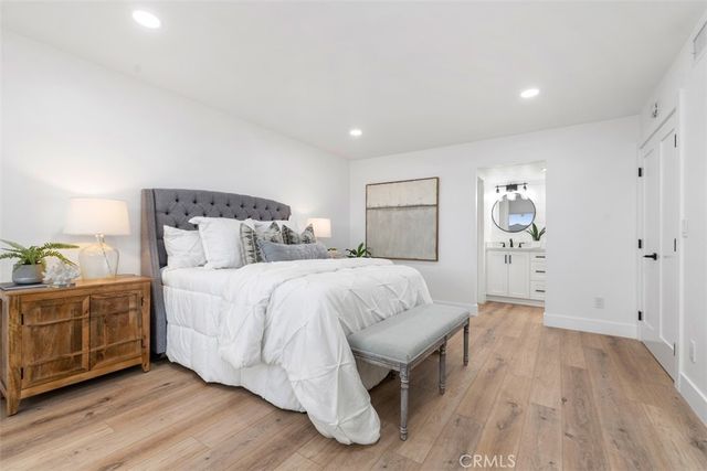 a bedroom with a bed and a table