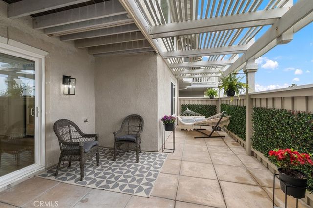a view of back yard with outdoor seating