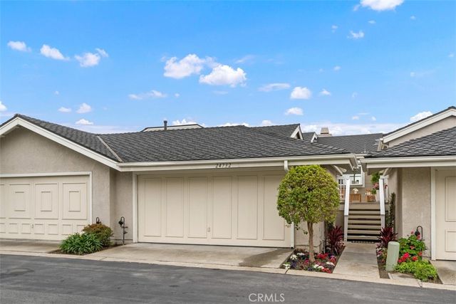 a front view of a house with yard