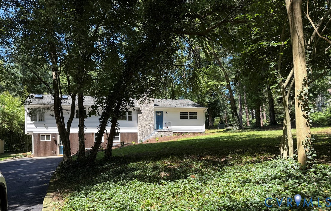 7335 Cherokee Road Richmond, VA 23225 - Photo 1 of 30 a view of a house with a backyard