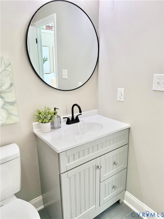 7335 Cherokee Road Richmond, VA 23225 - Photo 18 of 30 a bathroom with a sink and a mirror