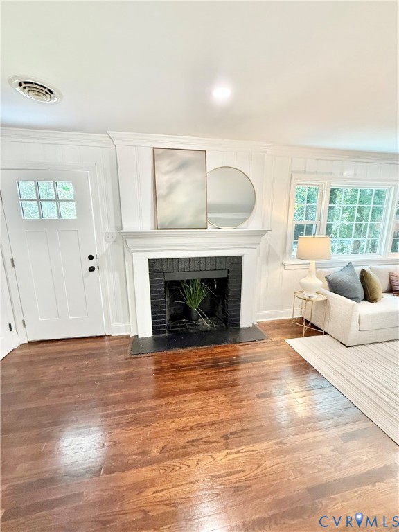7335 Cherokee Road Richmond, VA 23225 - Photo 19 of 30 a living room with furniture and a fireplace