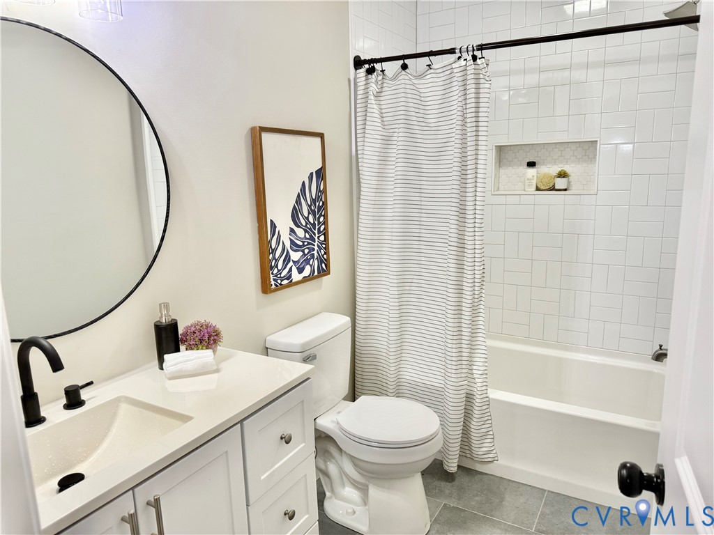 7335 Cherokee Road Richmond, VA 23225 - Photo 21 of 30 a bathroom with a sink toilet and shower