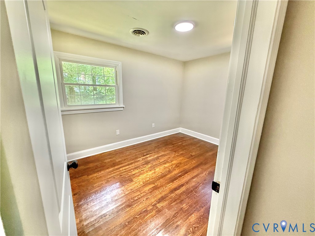 7335 Cherokee Road Richmond, VA 23225 - Photo 23 of 30 a view of a room with wooden floor and window
