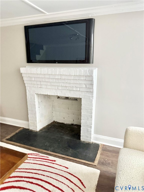 7335 Cherokee Road Richmond, VA 23225 - Photo 26 of 30 a living room with a fireplace and a rug