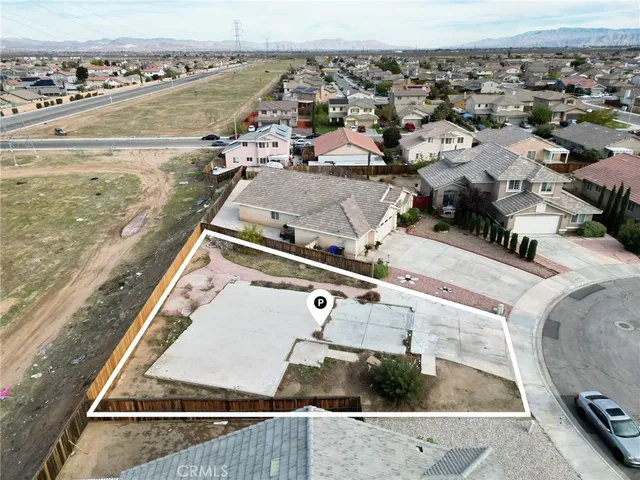 an aerial view of a house with a ocean view