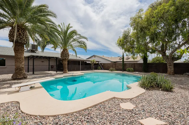 a view of a swimming pool with a garden