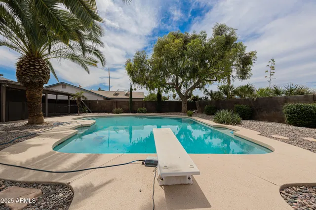 a view of a swimming pool with a patio