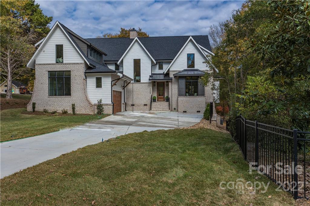 7209 Ramsgate Road Charlotte, NC 28270 - Photo 1 of 41 a front view of a house with a yard