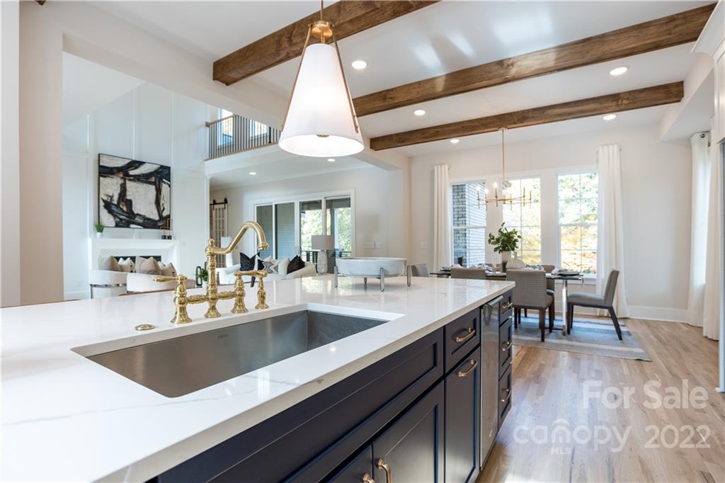 7209 Ramsgate Road Charlotte, NC 28270 - Photo 12 of 41 a kitchen with a sink appliances and a counter top space