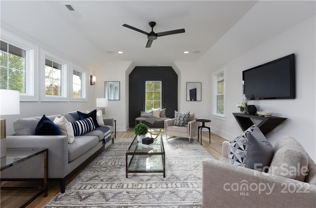 7209 Ramsgate Road Charlotte, NC 28270 - Photo 18 of 41 a living room with furniture and a flat screen tv