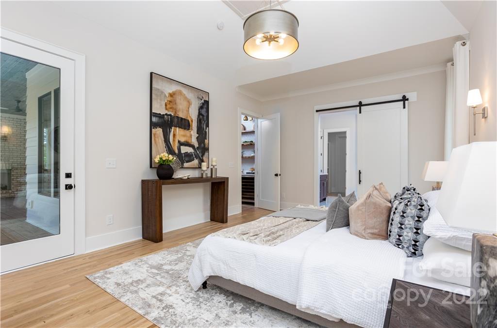 7209 Ramsgate Road Charlotte, NC 28270 - Photo 24 of 41 a bedroom with a bed and painting on the wall