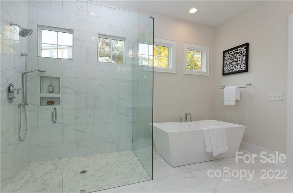 7209 Ramsgate Road Charlotte, NC 28270 - Photo 28 of 41 a bathroom with a sink a mirror and a shower