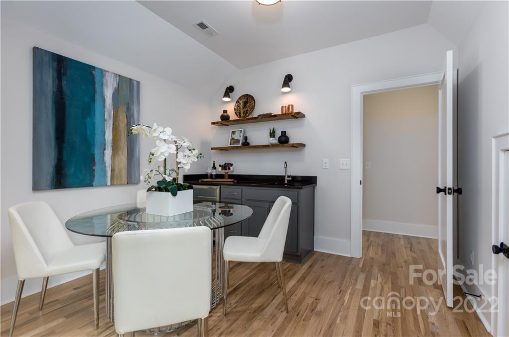 7209 Ramsgate Road Charlotte, NC 28270 - Photo 32 of 41 a dining room with furniture and wooden floor