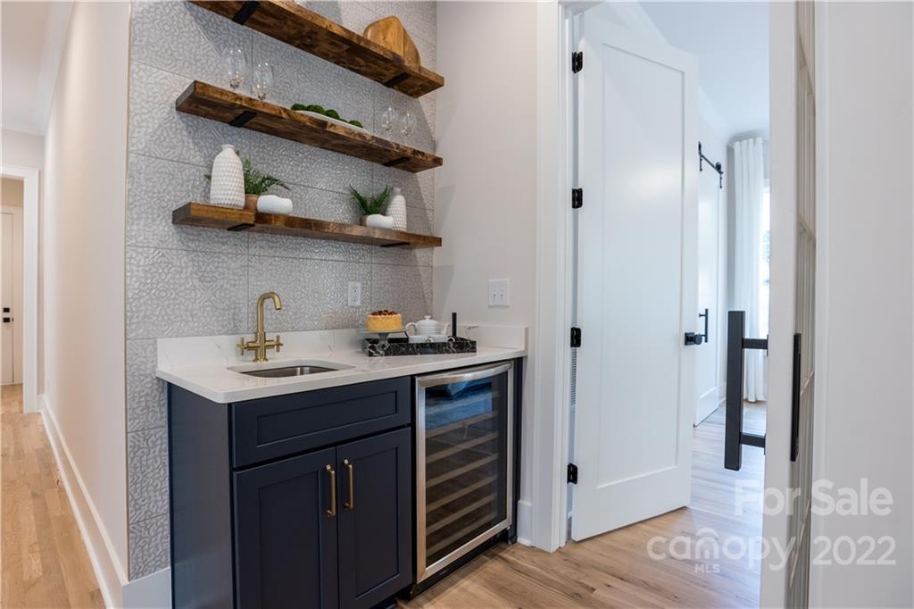 7209 Ramsgate Road Charlotte, NC 28270 - Photo 33 of 41 a kitchen with stainless steel appliances a sink and cabinets