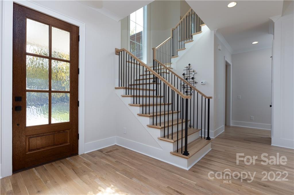 7209 Ramsgate Road Charlotte, NC 28270 - Photo 4 of 41 a view of staircase with white walls and windows