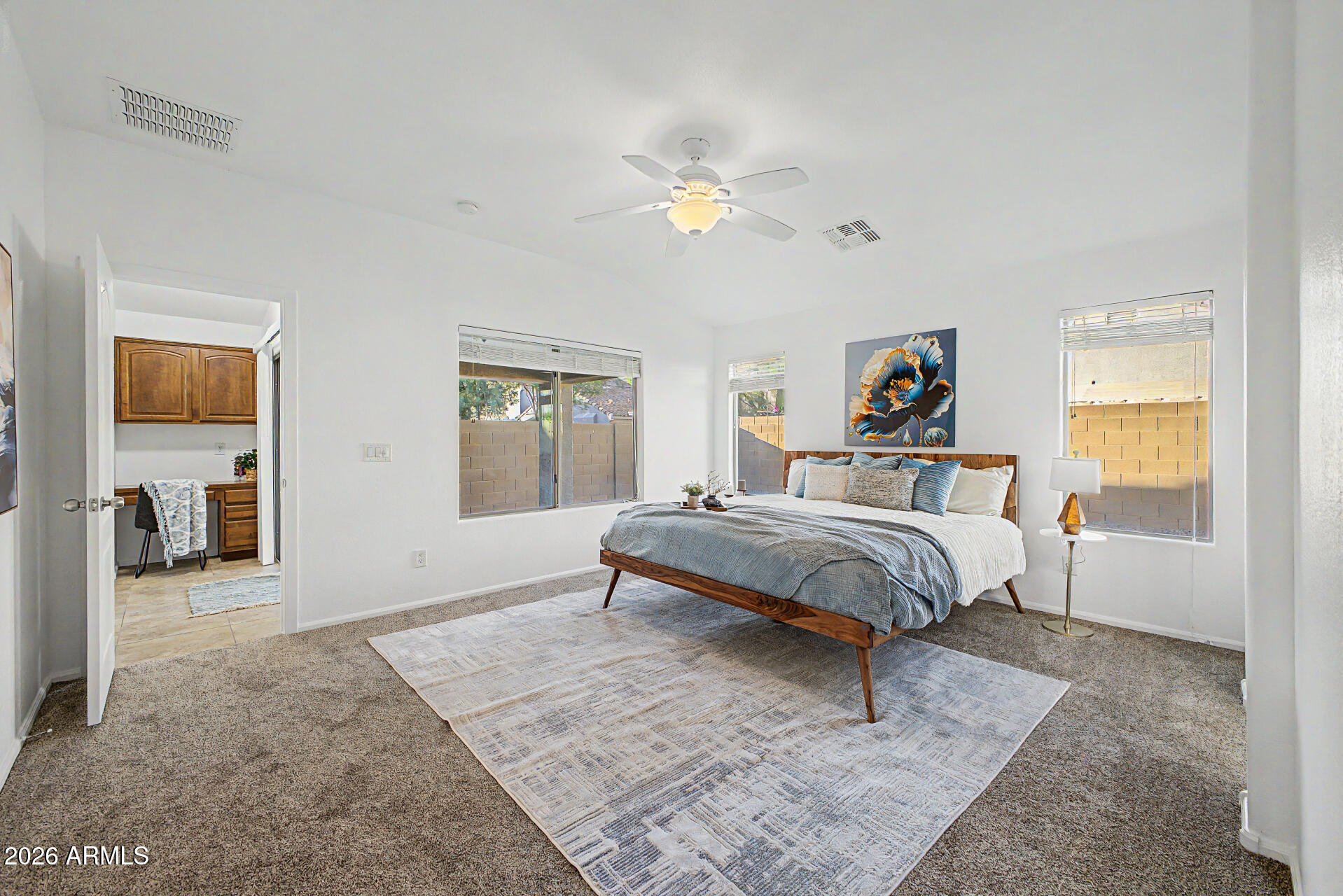 4168 East Sandy Way Gilbert, AZ 85297 - Photo 15 of 47 a bedroom with a bed and a chandelier