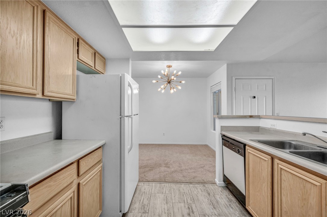 8070 West Russell Road, Unit 2060 Las Vegas, NV 89113 - Photo 5 of 47 This bright kitchen offers a practical layout with direct views into the dining area.