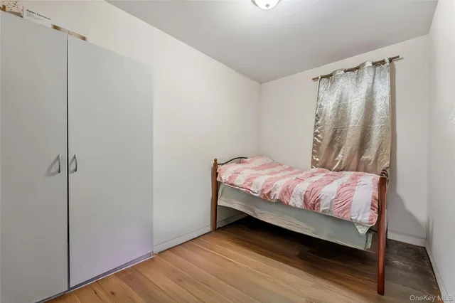 a bedroom with a bed and a shower