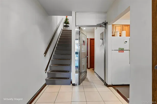 a view of entryway with stairs and wooden floor