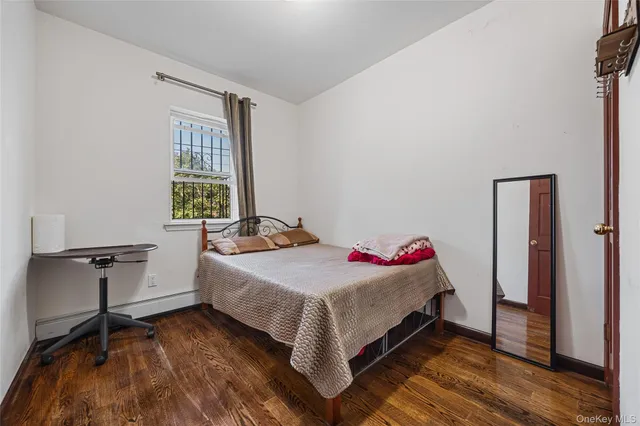 a bedroom with a bed and a table